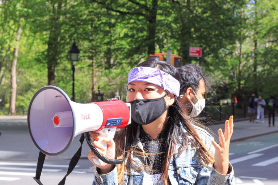 GSOC member leads slogans with a megaphone. 