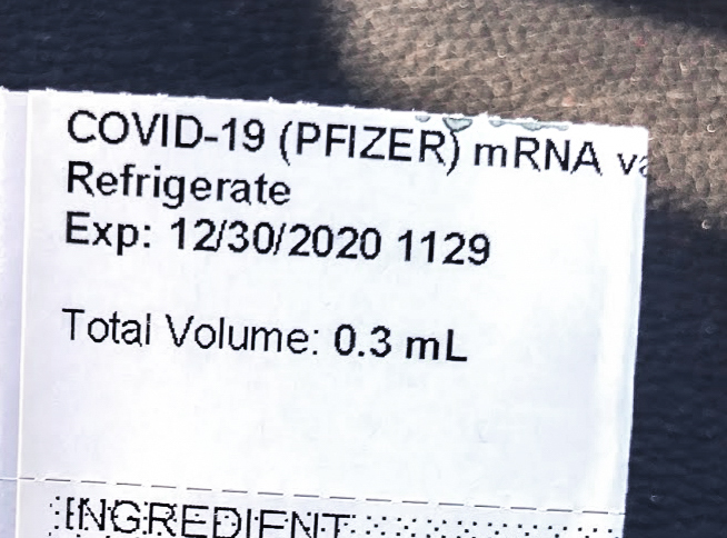 A Pfizer vaccine information label details its contents. International students face difficulties in regions without NYU-approved vaccines. (Staff Photo by Roshni Raj)