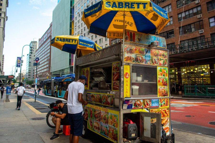 Many halal carts cluster around Union Square. Halal carts offer a heaping to-go container of seasoned rice piled with the meat or vegetables of your choice for five or six dollars, making it an ideal cheap-eats meal. (Staff Photo by Manasa Gudavalli)