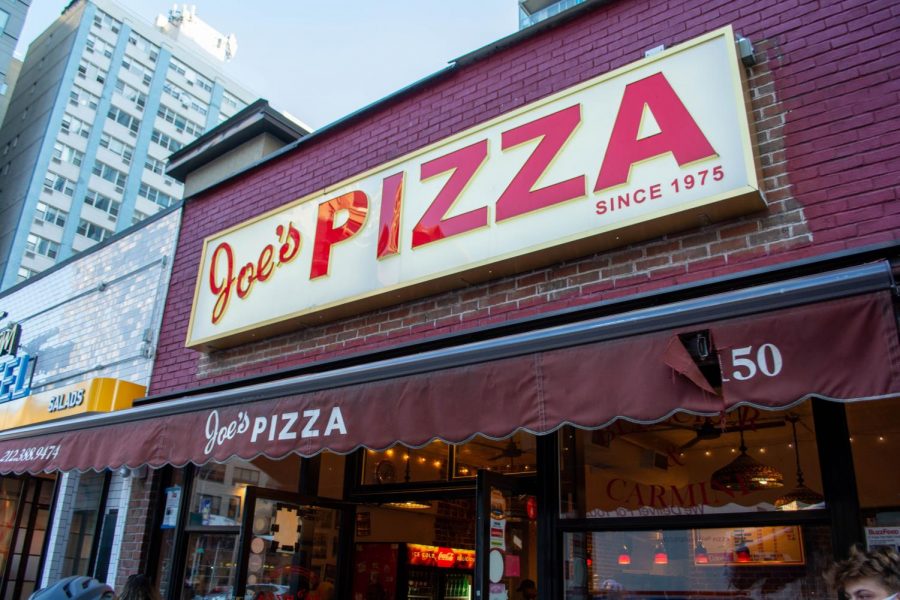Joe’s Pizza has been attracting New Yorkers and celebrities since the shop’s opening in 1975. (Staff Photo by Ryan Kawahara)