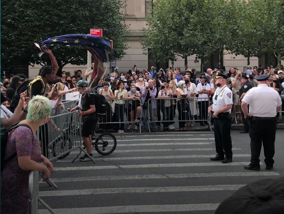 Protestors gather outside the Met Gala. While many of the biggest names in pop culture gathered inside the gallery, police and protestors clashed outside the event. (Photo by Sarah Gil)