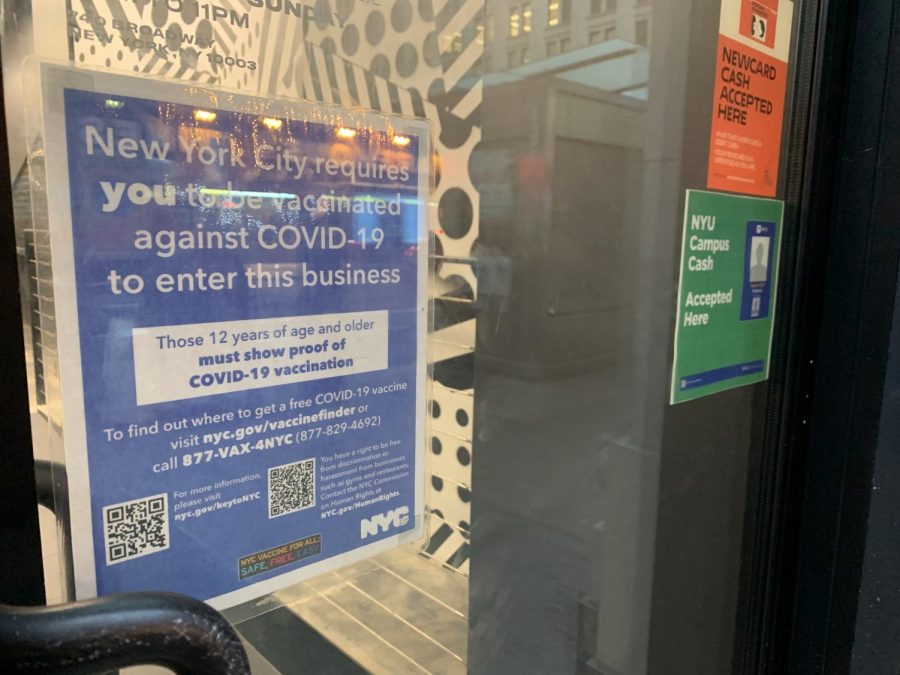 A+sign+outside+a+restaurant+near+campus+tells+patrons+that+they+must+be+vaccinated+to+be+served.+However%2C+many+NYU+students+have+reported+that+local+businesses+are+not+complying+with+Mayor+DeBlasio%E2%80%99s+mandate.+%28Staff+Photo+by+Jake+Capriotti%29