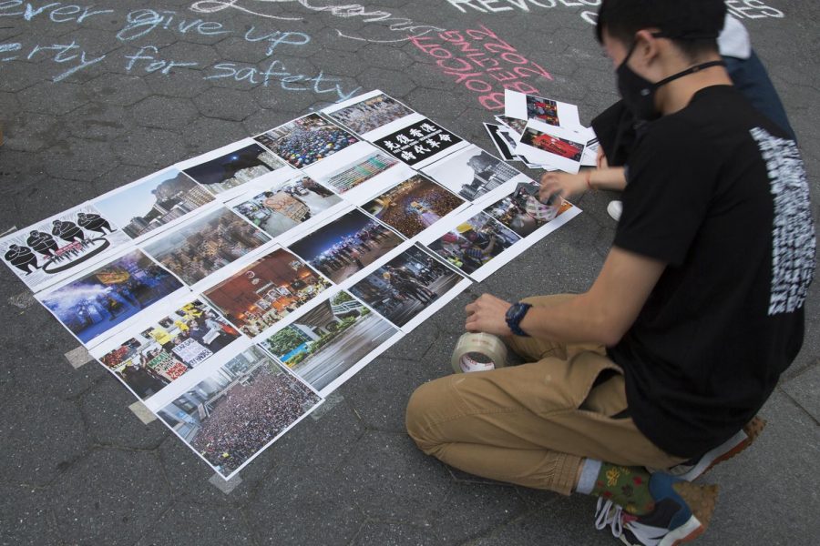 NYU’s Hong Kong Student Advocacy Group displays artwork to spread awareness of the Chinese government’s treatment of Hong Kong. The group organized a protest at Washington Square Park in solidarity with protesters in Hong Kong. (Photo by Thirdblade Photography)