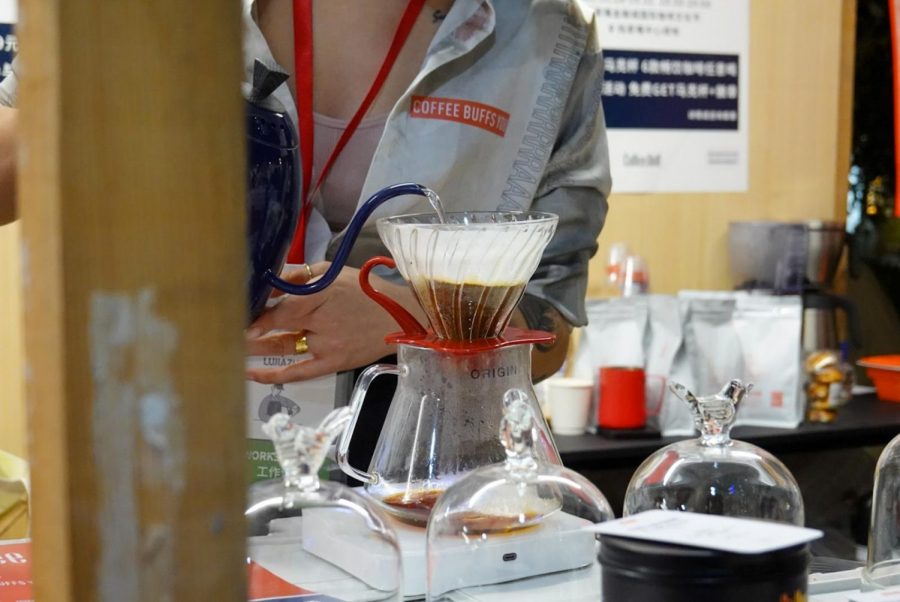 A barista at Coffee Buffs filters coffee. With more than 7,000 coffee shops, Shanghai is the city with the most coffee shops in the world. (Photo by Claire Yao)