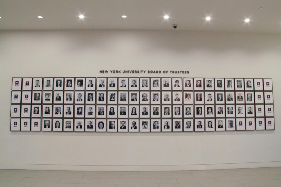 A wall with photographs of NYU trustees on display at the Kimmel Center for University Life. (Alexandra Chan for WSN)