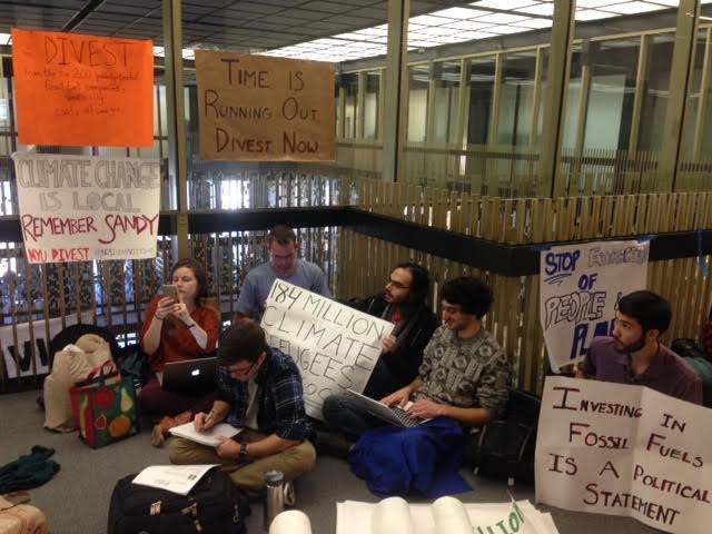 NYU Divest members sit in on the 12th floor of Bobst Library waiting to confront university administrators in 2015. (Photo by Lexi Faunce)
