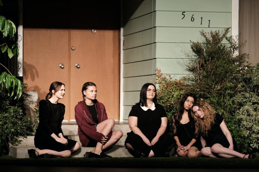 A still from season 2 of the HBO show “Euphoria” features the main cast of Lexis school play. The five actors are seated on the steps of the stage and look ahead.