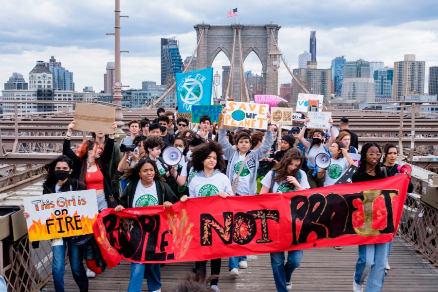 On Friday, March 25, hundreds marched from Brooklyn Borough Hall to Manhattan’s Foley Square in a strike condemning government inaction against climate change. The crowd crossed the pedestrian path on the Brooklyn Bridge. (Staff Photo by Samson Tu)