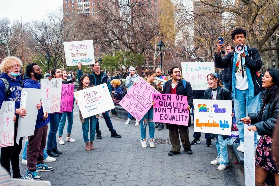 A+reproductive+rights+protest+at+Washington+Square+Park.+Protesters+hold+signs+saying+%E2%80%9CJews+for+Productive+Rights%2C%E2%80%9D+%E2%80%9CMen+of+Quality+don%E2%80%99t+fear+Equality%2C%E2%80%9D+%E2%80%9CNYU+stand+up+for+Reproductive+Rights%2C%E2%80%9D+%E2%80%9CSex+is+beautiful%3B+Reproduction+is+optional%2C%E2%80%9D+%E2%80%9CAbortion+is+Healthcare%E2%80%9D+and+%E2%80%9CAbortion+%3D+Healthcare+%3D+Human+Right.%E2%80%9D+NYU+sophomore+JJ+Briscoe+holds+a+megaphone+and+speaks+to+the+crowd.
