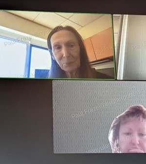 Photo of a Zoom meeting screen. Paul Frazel's email address is overlaid many times in transparent text. In the two panels visible are Grossman executive Dafna Bar-Sagi and Frazel