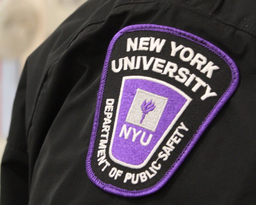 A purple uniform patch with the logo of the NYU Department of Public Safety on the shoulder of a Public Safety Officer.