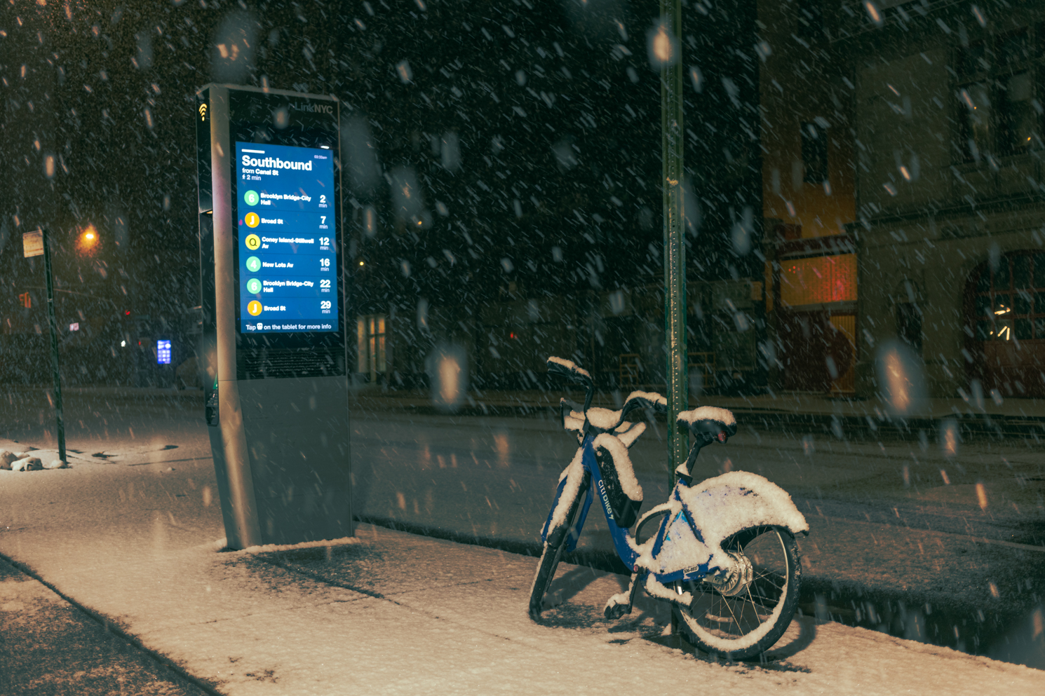 An MTA communication station to the left and an electric-assist Citi Bike to the right.