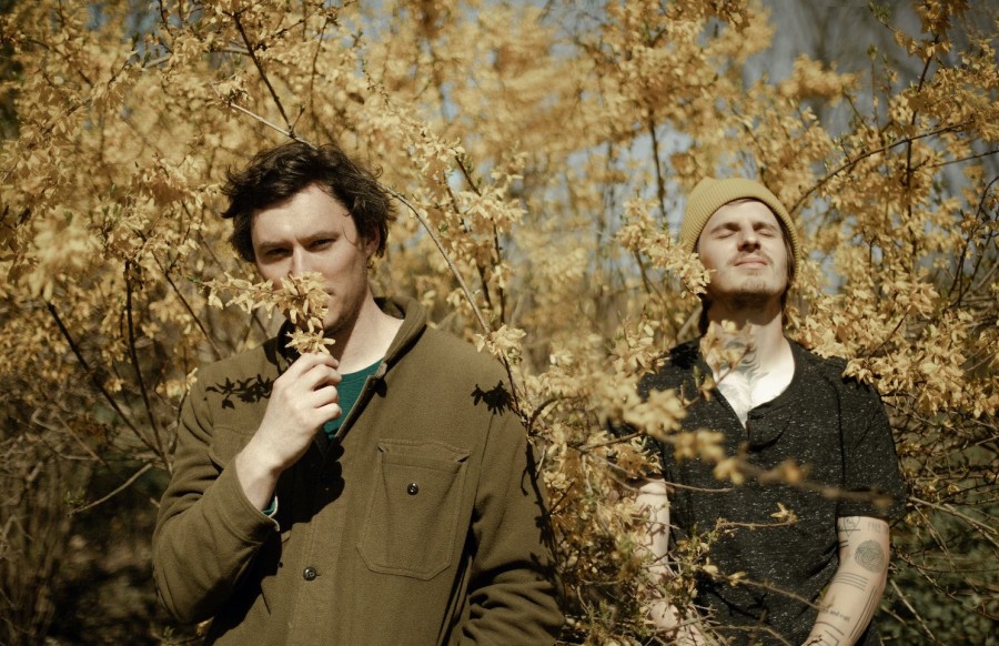 The Front Bottoms' guitarist Brian Sella and vocalist Mat Uychich standing in front of trees.