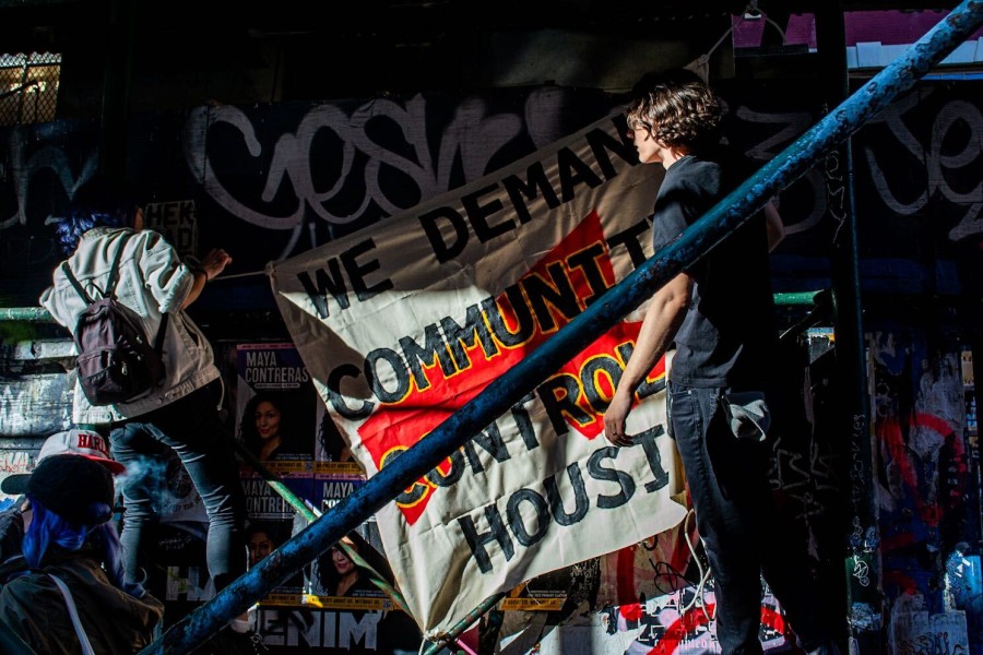 Banners are hung at Anarchy Row in the East Village during a rally organized by Brooklyn Eviction Defense and the Rent Refusers Network in April. (Staff Photo by Manasa Gudavalli)