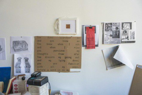 On a white wall are cutouts from magazines, a laser-printed quote block and prints of various stone models in a corner of Lizzy Chemel’s studio.