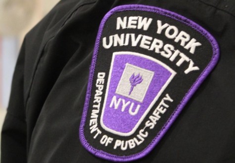 A purple uniform patch with the logo of the NYU Department of Public Safety on the shoulder of a Public Safety Officer.