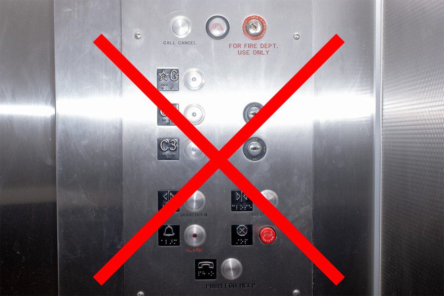 An image of an elevator button panel with a red X drawn over it.