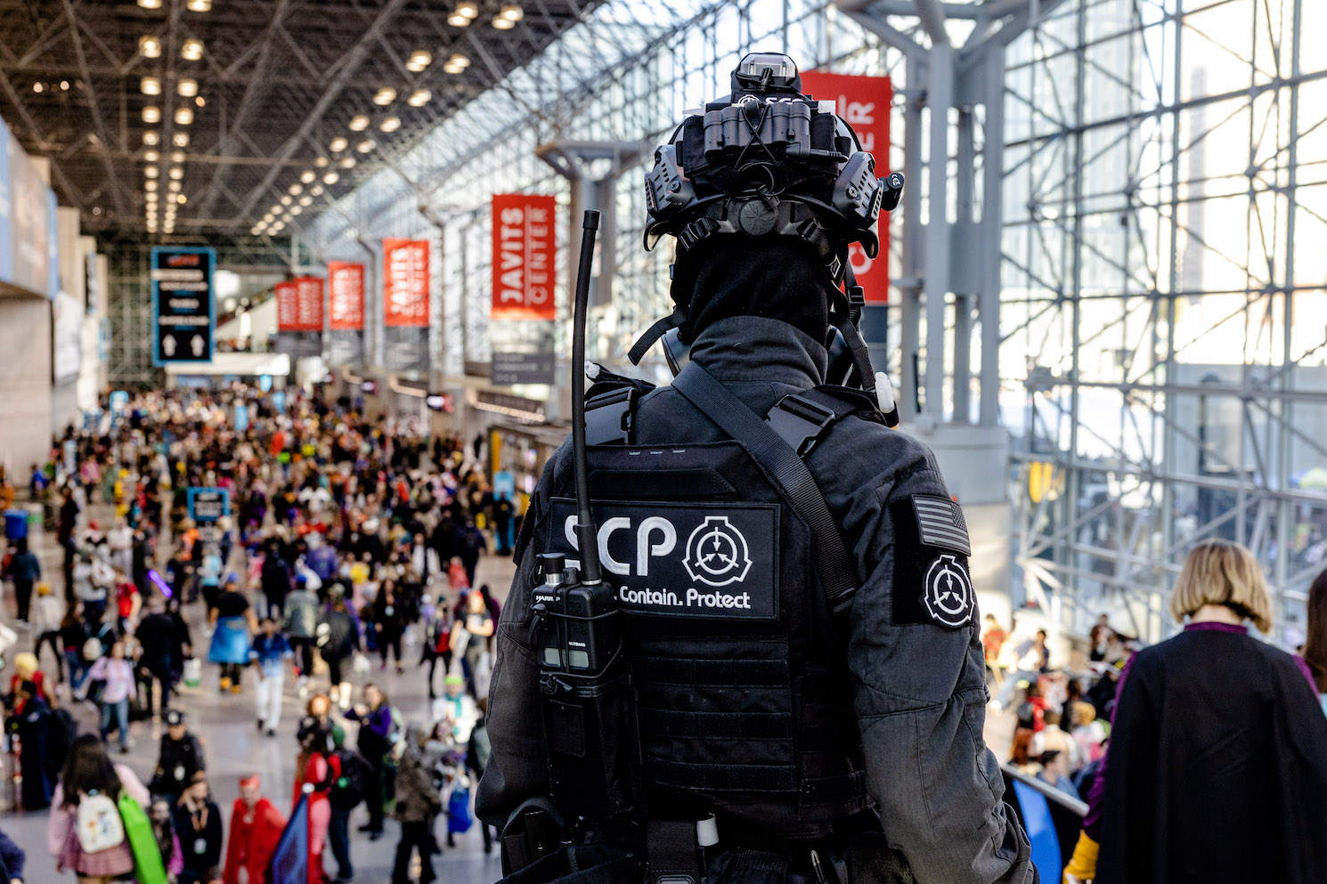 A cosplayer dressed in black police uniform in the Javits Center.