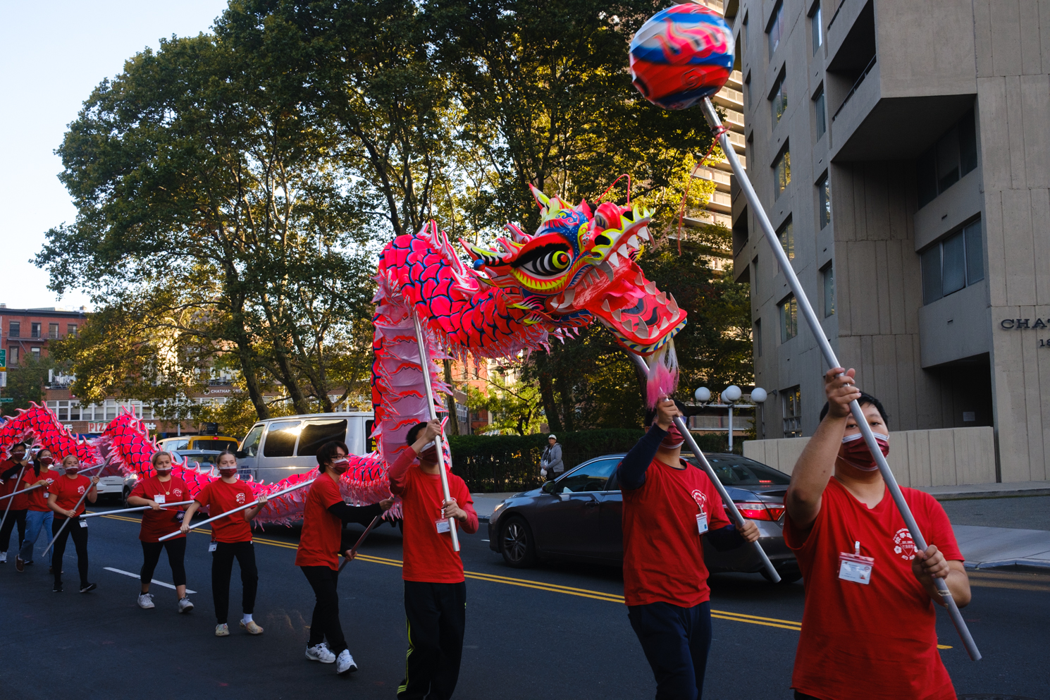 A dancing dragon marches through the parade on Worth Street.