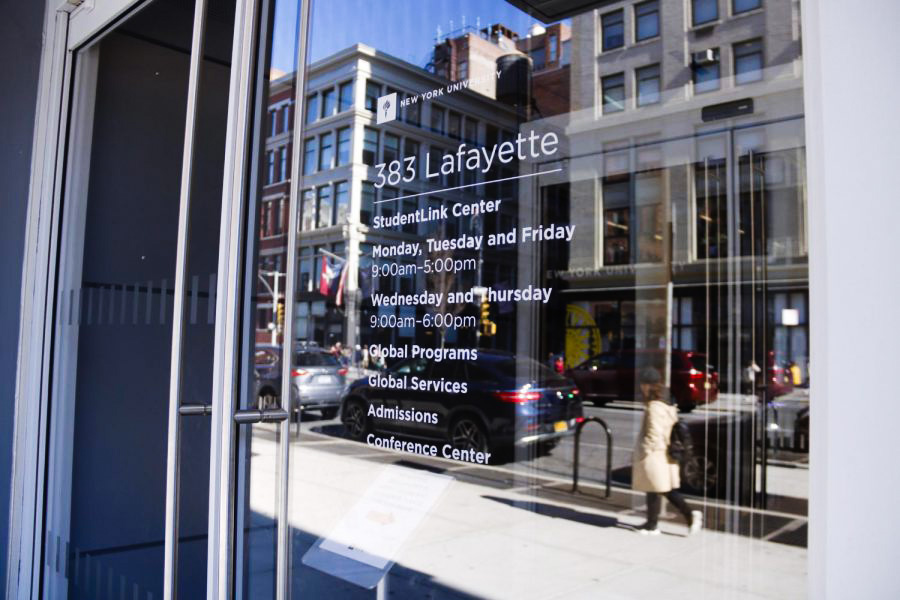 Exterior photo of the N.Y.U. Office of Global Services with white text reading “383 Lafayette” on the window.
