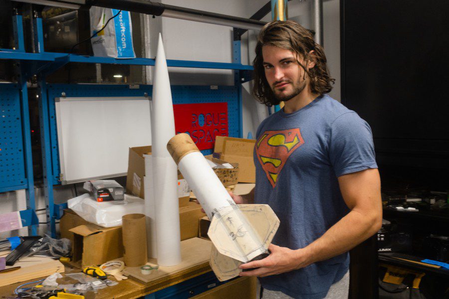 Alex Miller showcases the fins of his rockets made out of fiberglass.