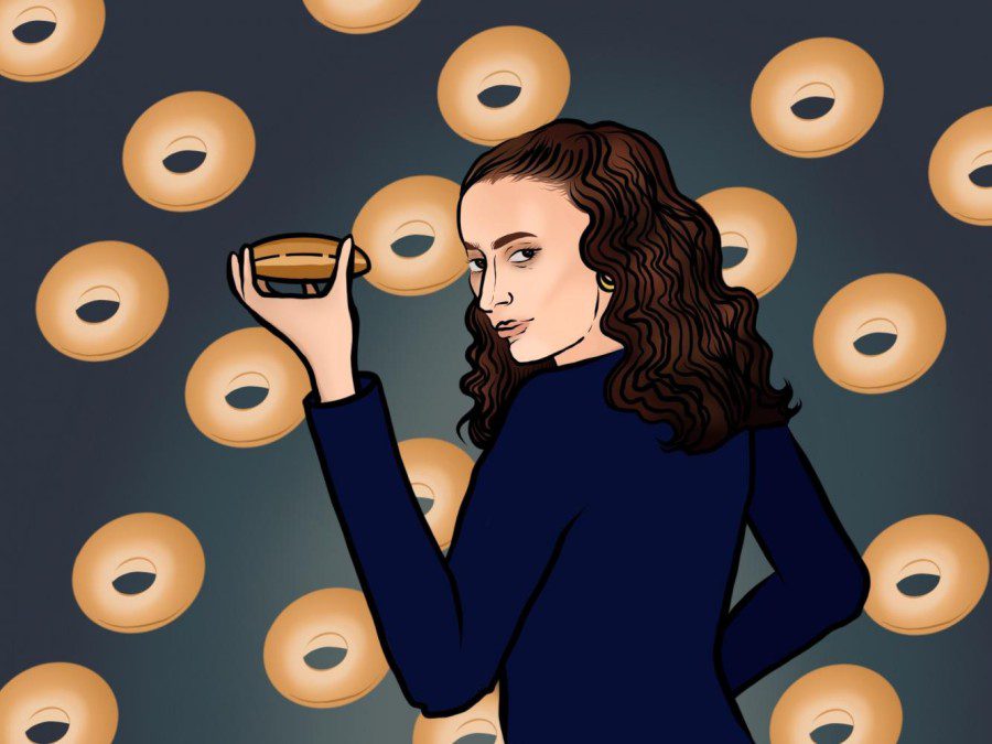 An+illustration+of+a+brown-haired+woman+in+a+long-sleeve+blue+shirt+holding+a+bagel+with+her+left+hand.+Behind+her+there+are+floating+bagels+in+vertical+lines%2C+against+a+dark+blue+background.