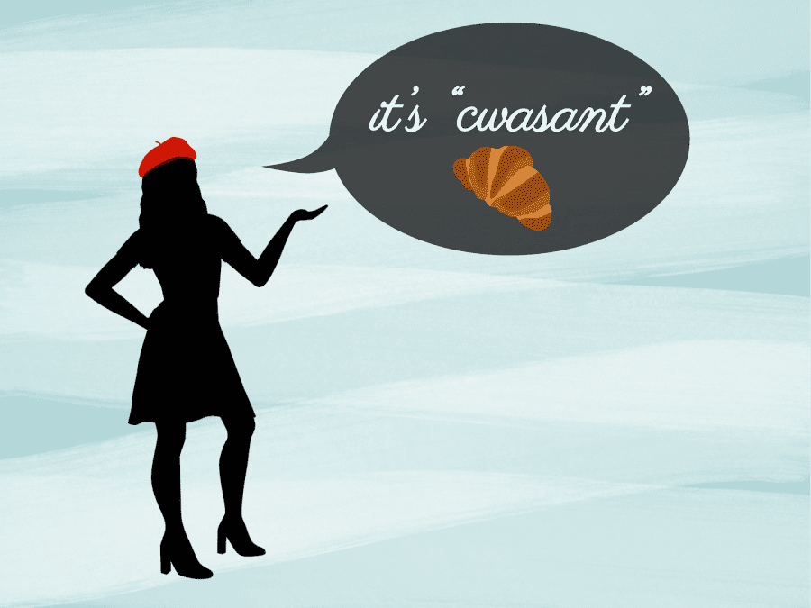 A figure dressed in a pink beret stands next to an illustration of a croissant. A text bubble is in between the two that reads “it’s ‘croissant.’”