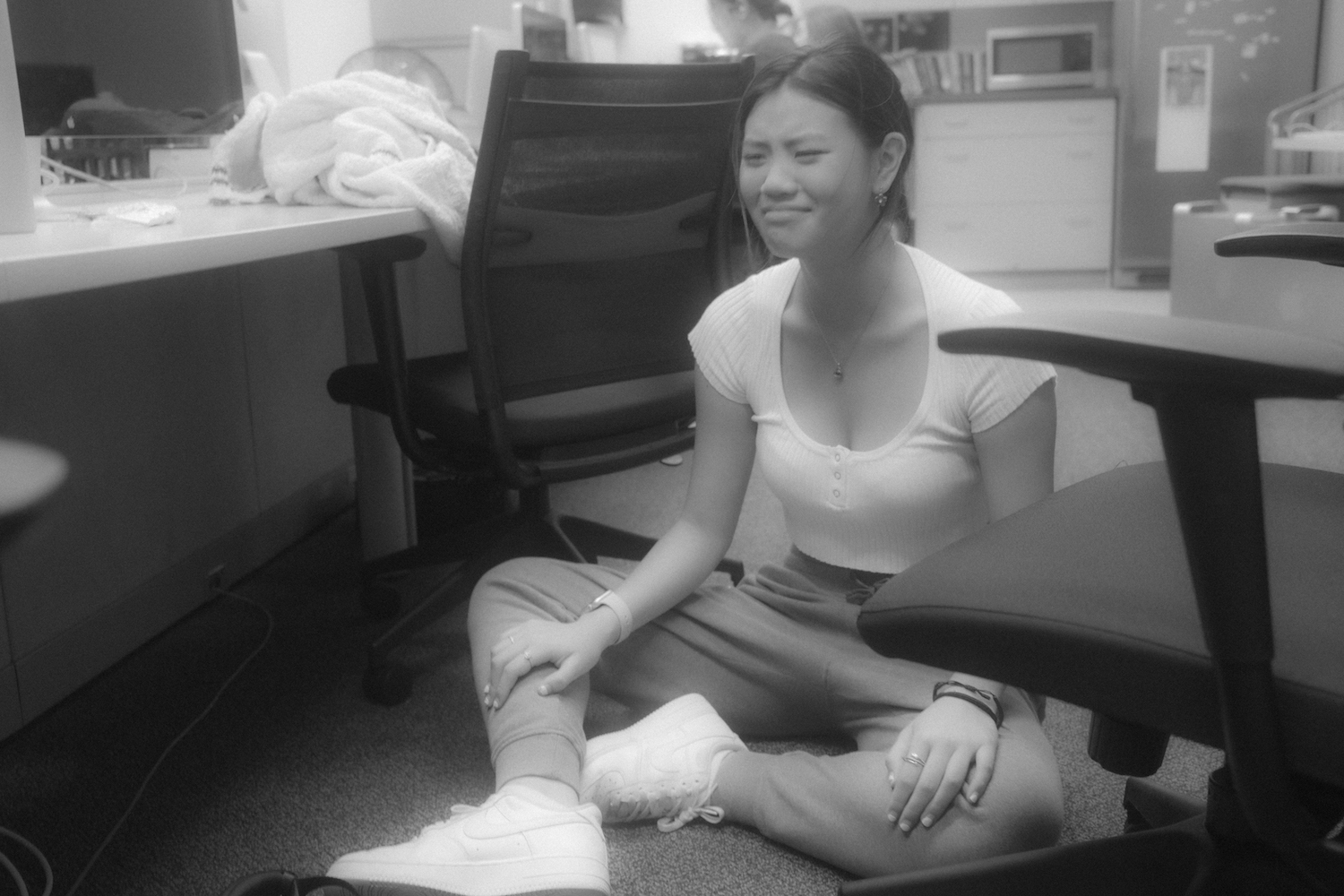 Eileen Liu cries while sitting on the floor