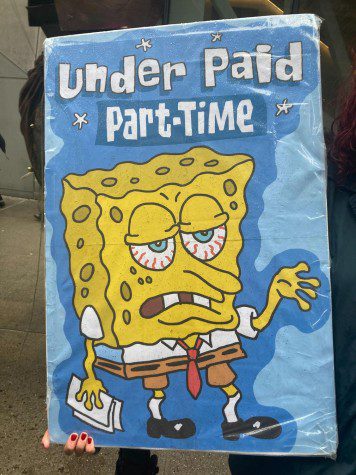 A person holding a sign reads “under paid part-time.” Under the text is the cartoon character SpongeBob SquarePants with bloodshot eyes while holding some paper in its right hand.