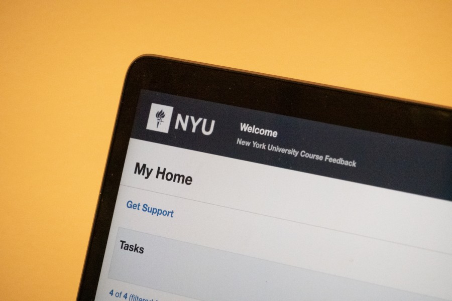 A laptop screen displaying a webpage that indicates the course feedback website for New York University.