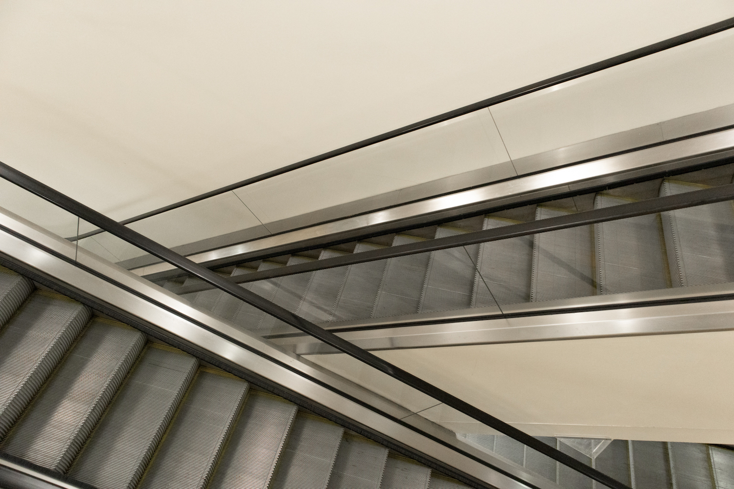 A photo of two stationary escalators at the Kimmel Center for University Life.