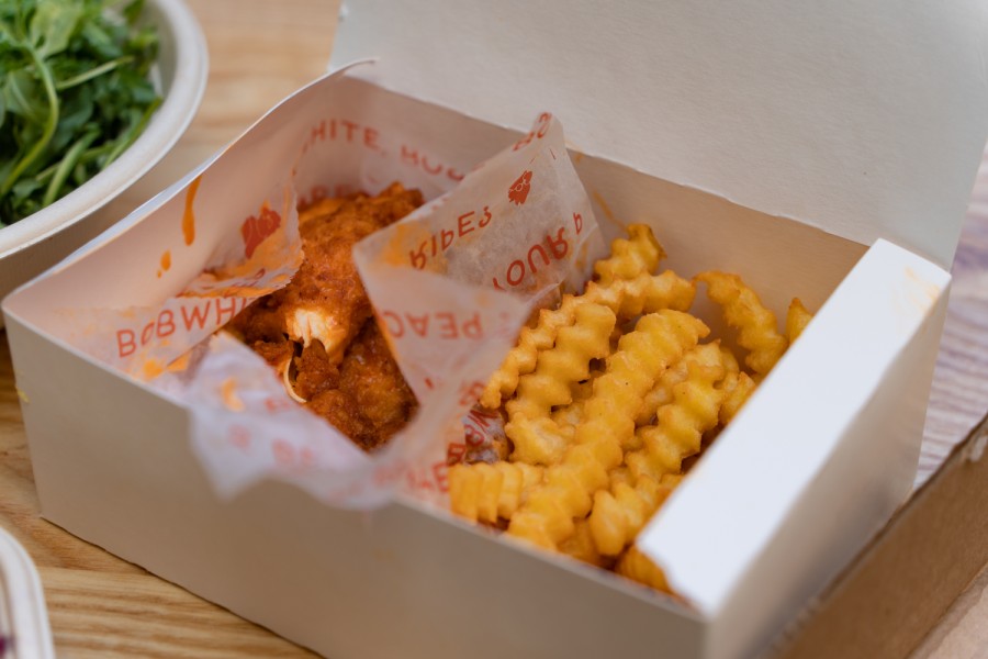 A box of buffalo chicken tenders and fries.