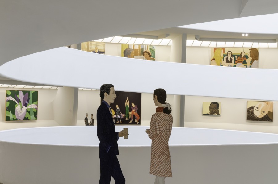 An illustration of two figures conversing at the Guggenheim Museum. Various paintings are displayed on the walls above the spiraling, white balconies.