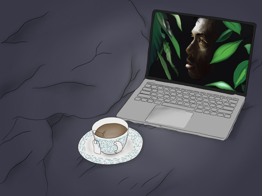 A+dark+blue+bedsheet+with+a+laptop+on+it+showing+a+man%E2%80%99s+face+hidden+between+leaves+on+the+screen.+A+white+teacup+with+blue+details+and+a+tea+bag+draped+over+its+side+sits+in+front+of+the+computer.