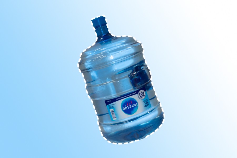 A large, blue, plastic water jug against a blue gradient background. On the jug is a label reading “Pure Life.”