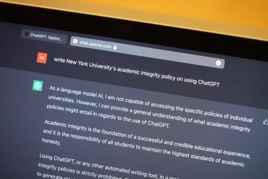 A laptop screen displaying the user interface of the artificial intelligence writing tool “Chat G.P.T.” with the prompt “write New York University’s academic integrity policy on using chat G.P.T.” on the top.