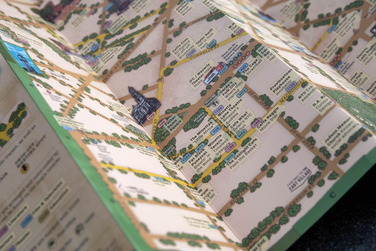 A close-up of a colorful, illustrated map of Greenwich Village in New York City.