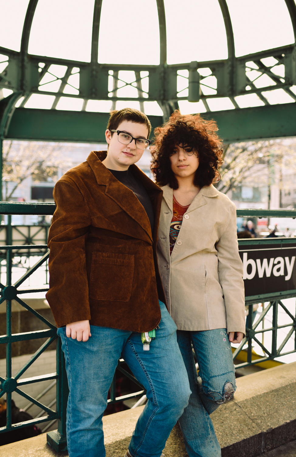Raphael Williams and Shagg Solarz stand together in front of the subway station in Union Square Park. They face the camera.