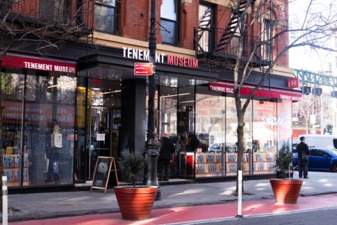 The exterior of the Tenement Museum entrance. The museum gift shop is visible through the windows.