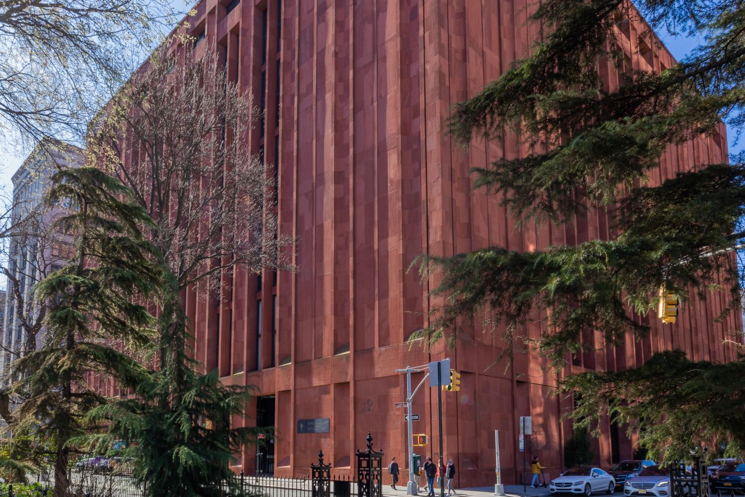 NYU’s Bobst Library with trees pictured in front of it.