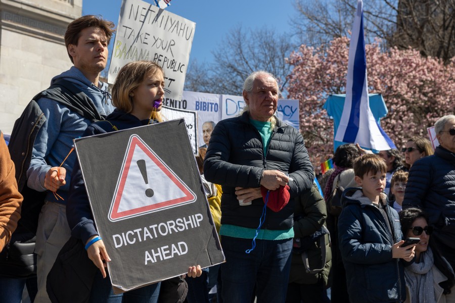 Protesters gather in Washington Square Park with signs that read “Dictator Ahead!” “Benito Bibito” and “Netanyahu take your banana republic and …”