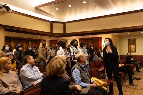 NYU Law assistant dean Michelle Cherande confronts students protesting in a room.