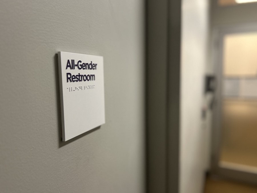A plaque on a door that reads, “All-Gender Restroom.”