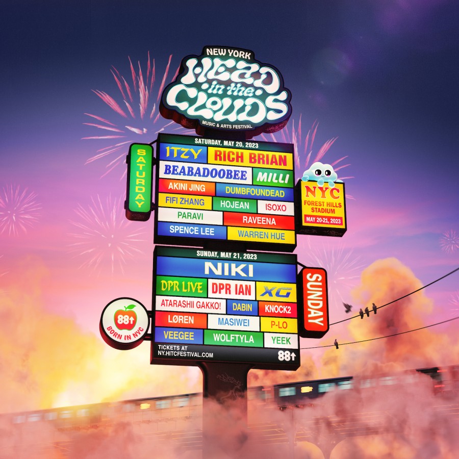 A colorful billboard that reads “New York head in the clouds music and arts festival” at the top. Behind the billboard, there are fireworks in the sky.