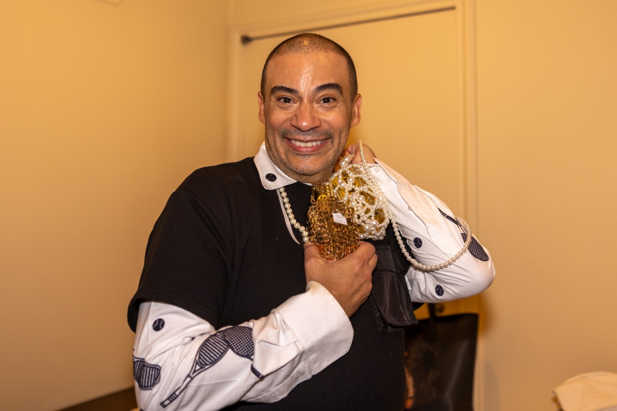 The designer Victor de Souza poses for a portrait after his runway show in the dressing room. (Danny Arensberg for WSN)