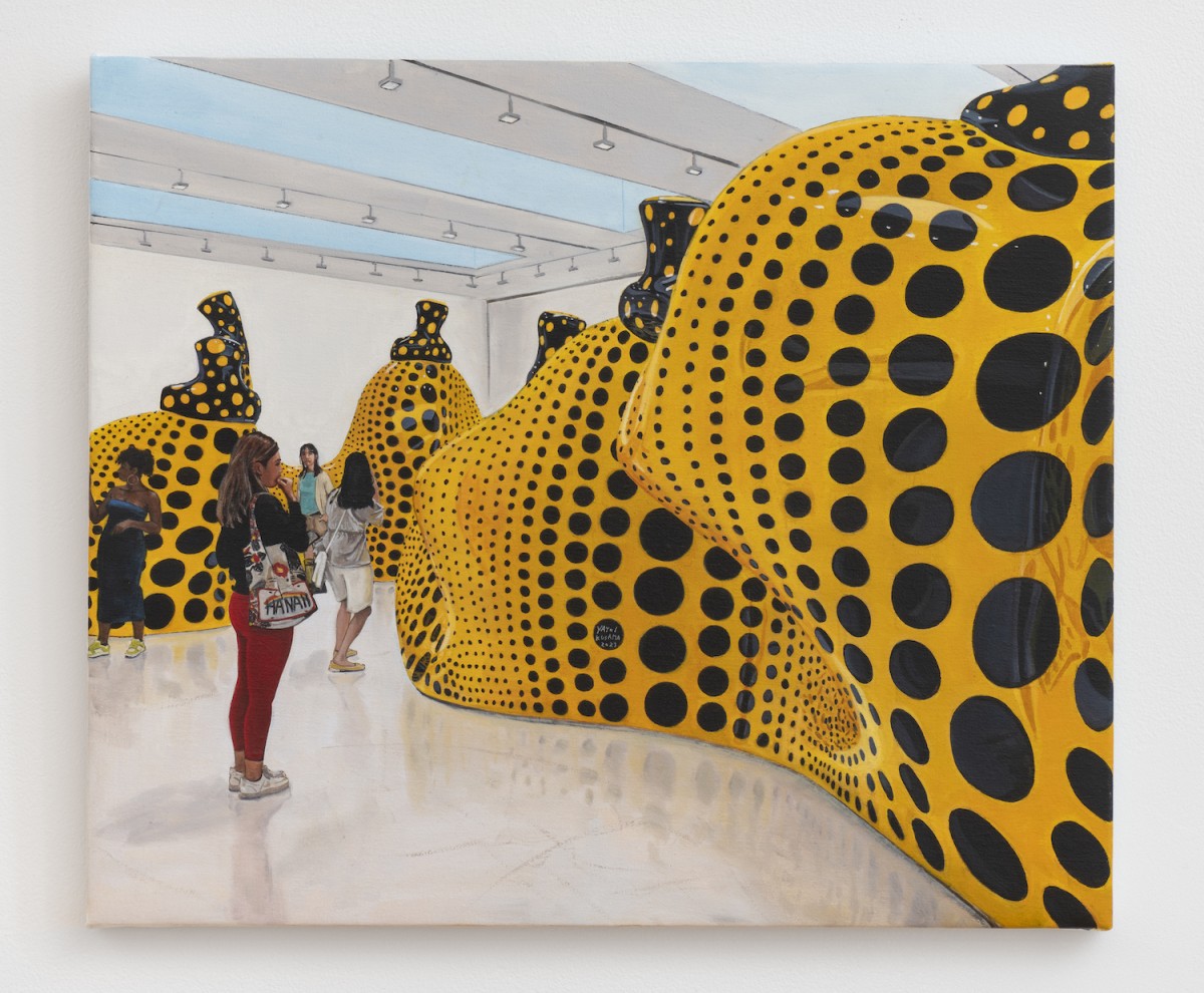 A photorealistic painting hangs on a white wall. The painting depicts an arts installation of several black-and-yellow dotted structures with people viewing them.