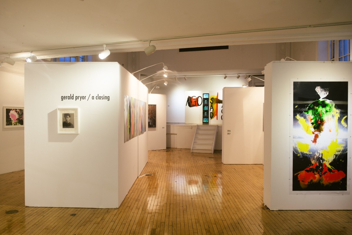 An exhibition titled “Gerald Pryor, slash, A closing.” An interior exhibition space with paintings and photographs hanging on white walls.