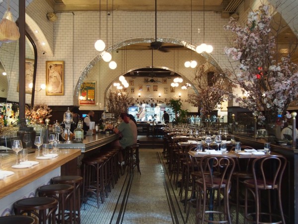 The interior of Boucherie with an arched white tiled ceiling.