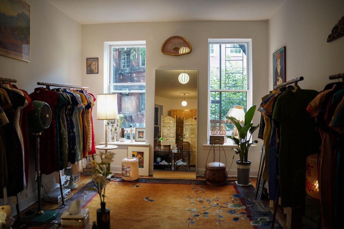 Interior of Heather Guo’s store, with Cheongsam dresses displayed on both sides and a fitting mirror in the center.