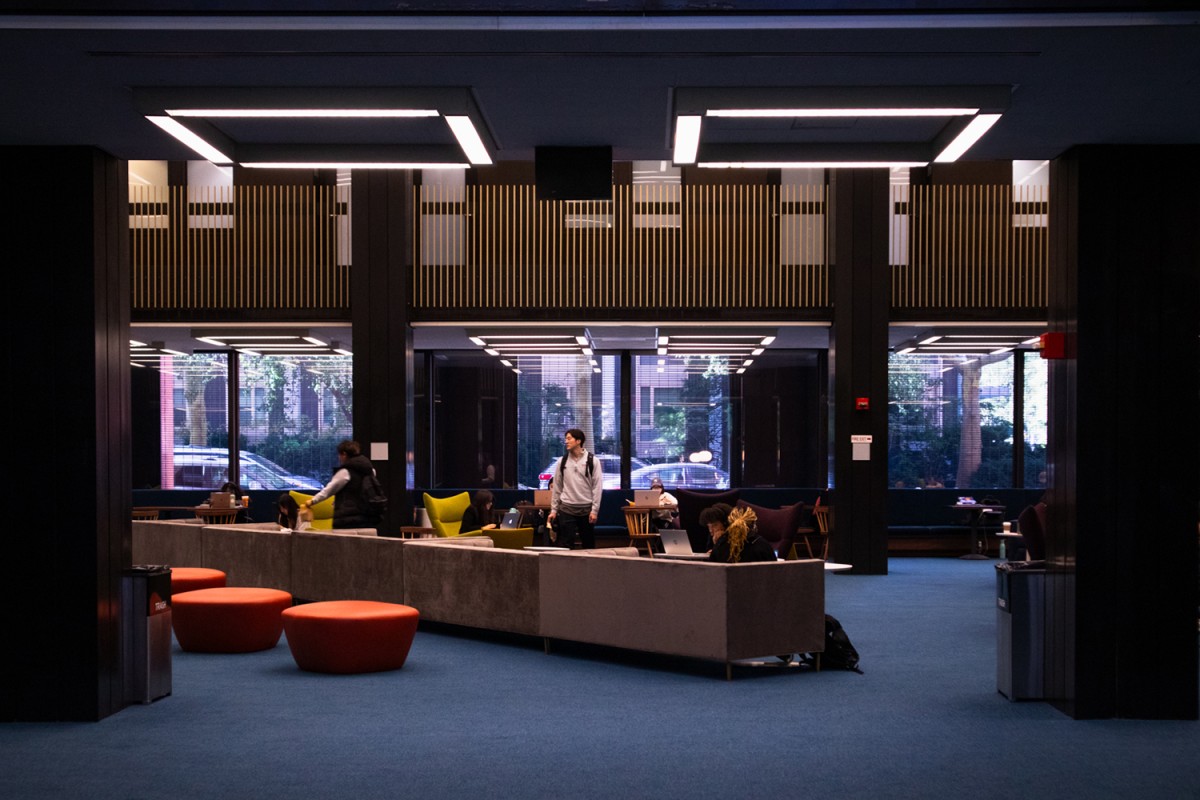 Students study on the newly renovated first floor of Bobst Library. The renovations include new couches, blue carpeting and updated lighting fixtures.